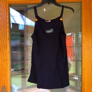 Brazilian top with wooden bead accents.